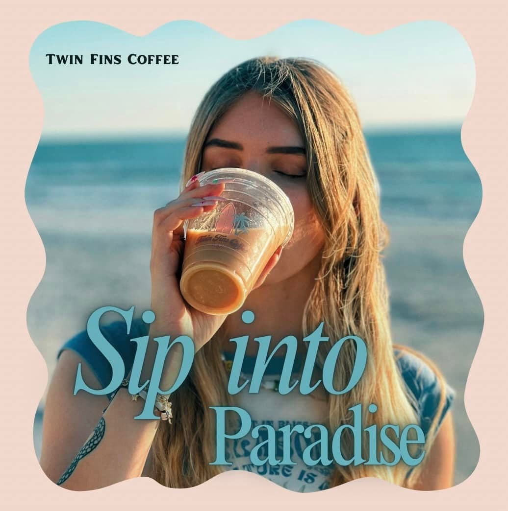 A Twin Fins iced coffee sipped on the beach under the words Sip into Paradise